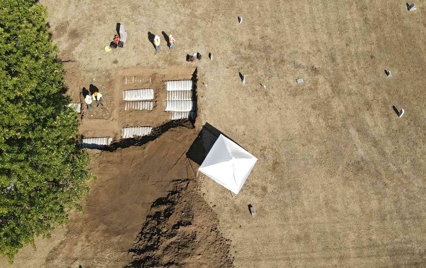 Crews work at Oaklawn Cemetery during an excavation while searching for bodies from the 1921 Tulsa Race Massacre, October 27, 2022, in Tulsa, Oklahoma.