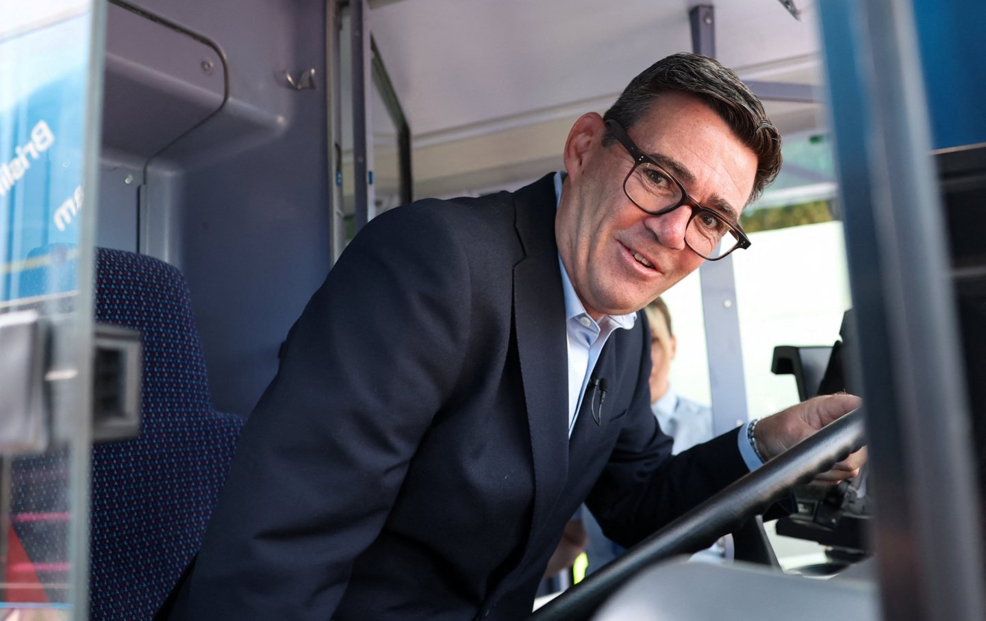 Prime Minister Andy Burnham is shown the driver's area on a FirstGroup bus at the bus station during a visit to Bath, England, Wednesday July 22, 2026.