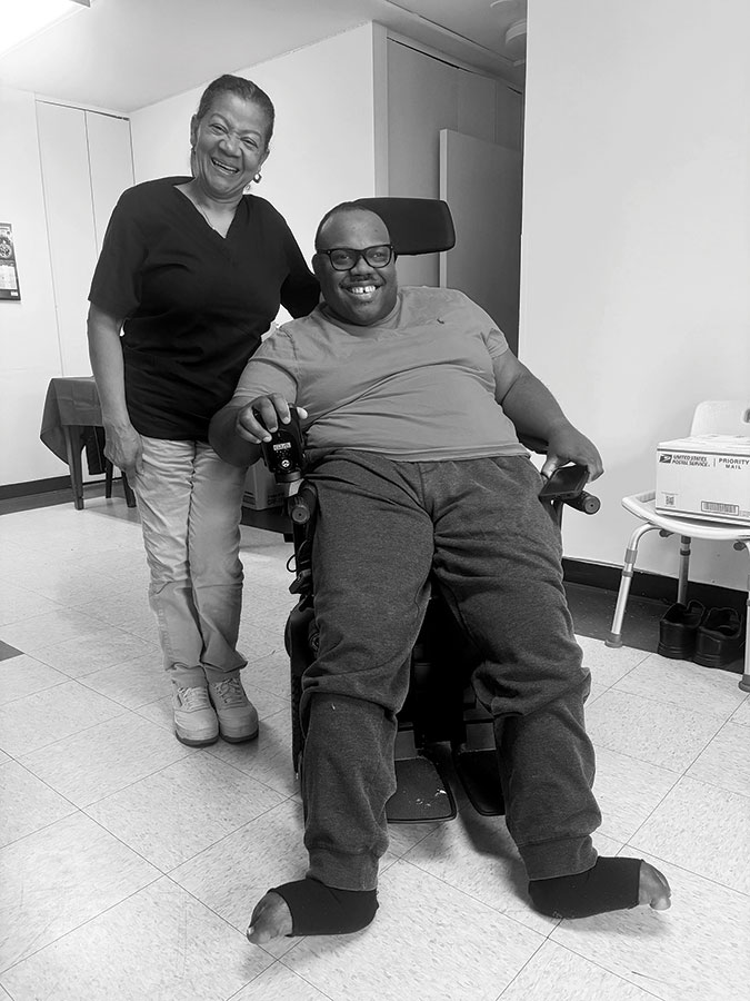Lasting connection: Clara Calvo and Sam in his St. Margaret’s House apartment.