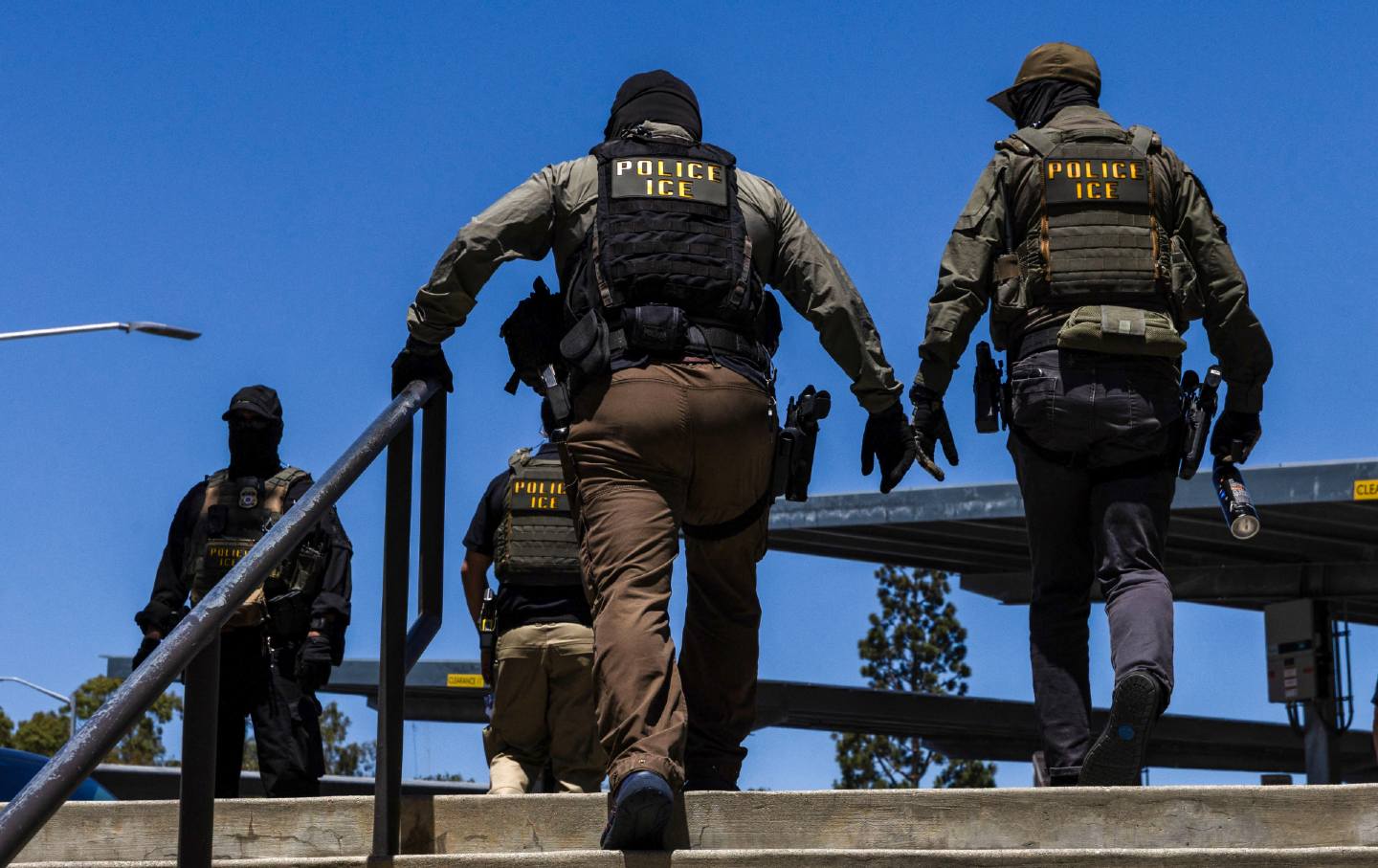 ICE agents walk outside the Ventura County Government Center in Ventura, California, on July 27, 2026.