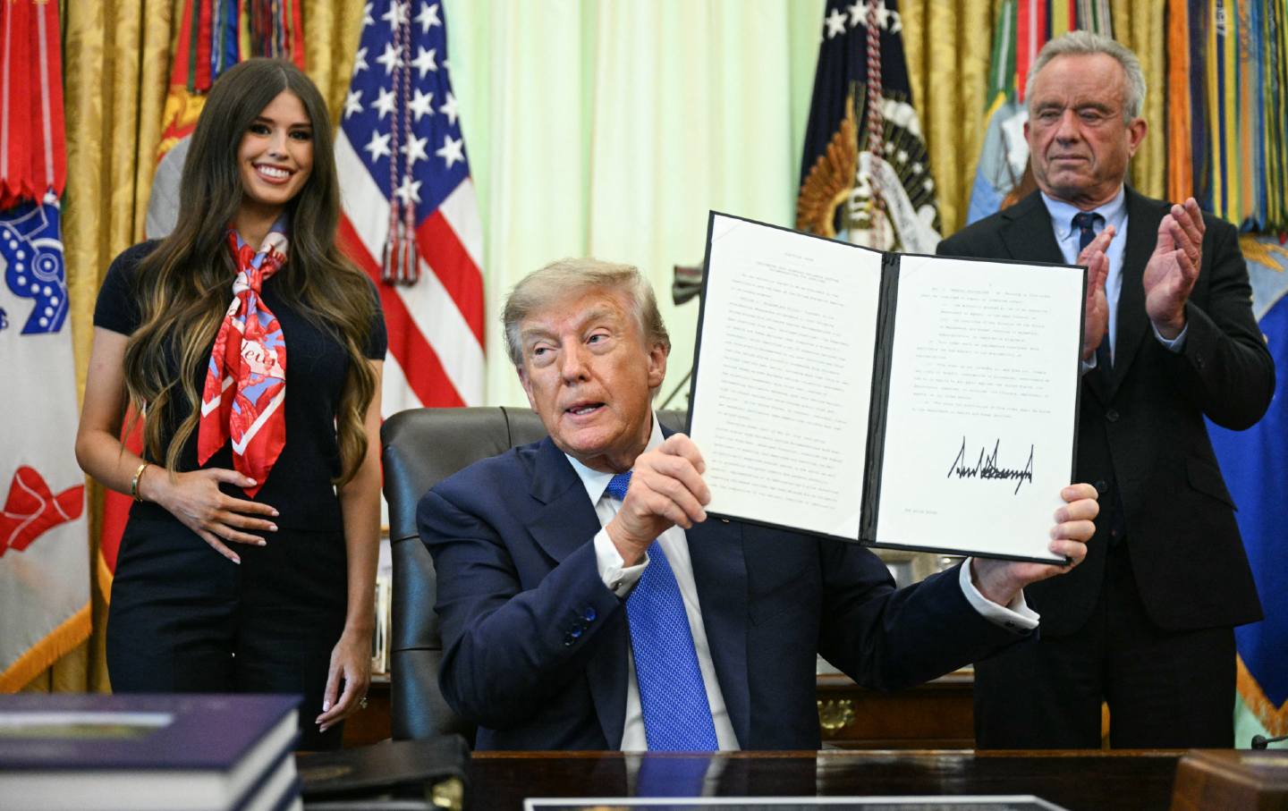 Donald Trump signs an executive order about vaccines on August 10, 2026.