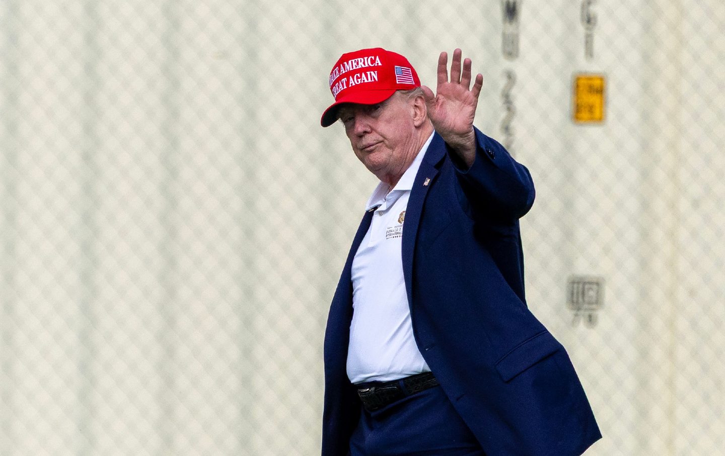 Donald Trump waves to the press after after landing at the Ellipse near the White House on August 16, 2026