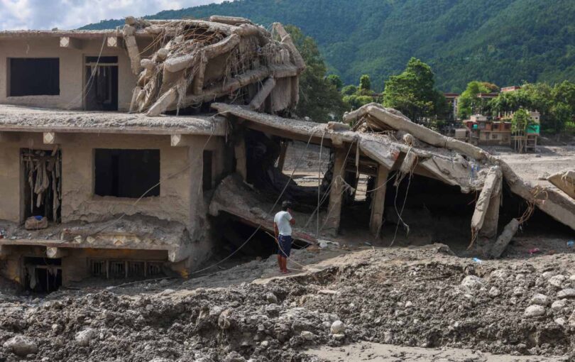 A man surveys the debris of a collapsed building at a town along the Trishuli River, in Devighat, Nuwakot, Nepal, on August 31, 2026.