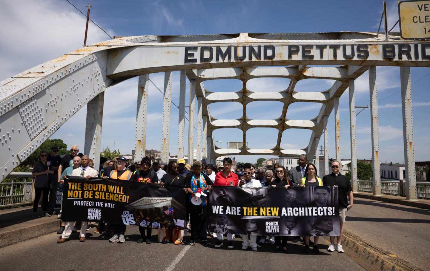 Participants from a coalition of voting rights groups march over the historic Edmund Pettus Bridge in Selma, Alabama, on May 16, 2026, in a protest following the Supreme Court decision “Louisiana v. Callais.”
