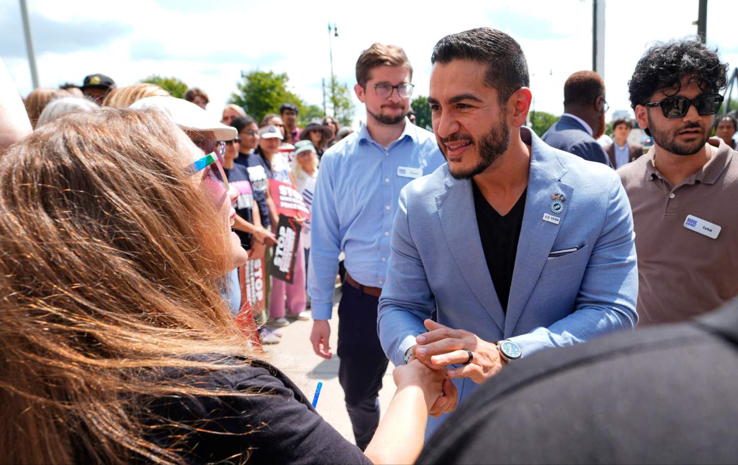Abdul El-Sayed greets a supporter at the end of a news conference at the base of the Spirit of Detroit monument in Detroit, Wednesday, Aug. 19, 2026.