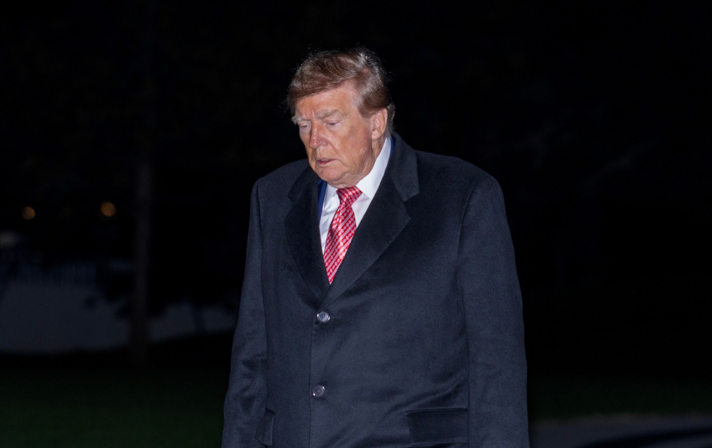 Donald Trump walks on the south lawn of the White House on October 18, 2026.