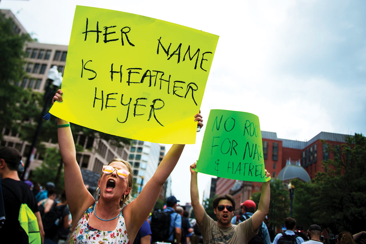 A protester in Washington, DC, name-checks Heather Heyer, who was killed during the 2017 white-nationalist rally in Charlottesville.