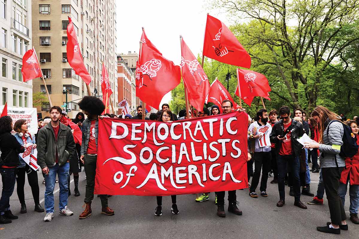 DSA members at a 2019 May Day action outside a Trump-owned property.