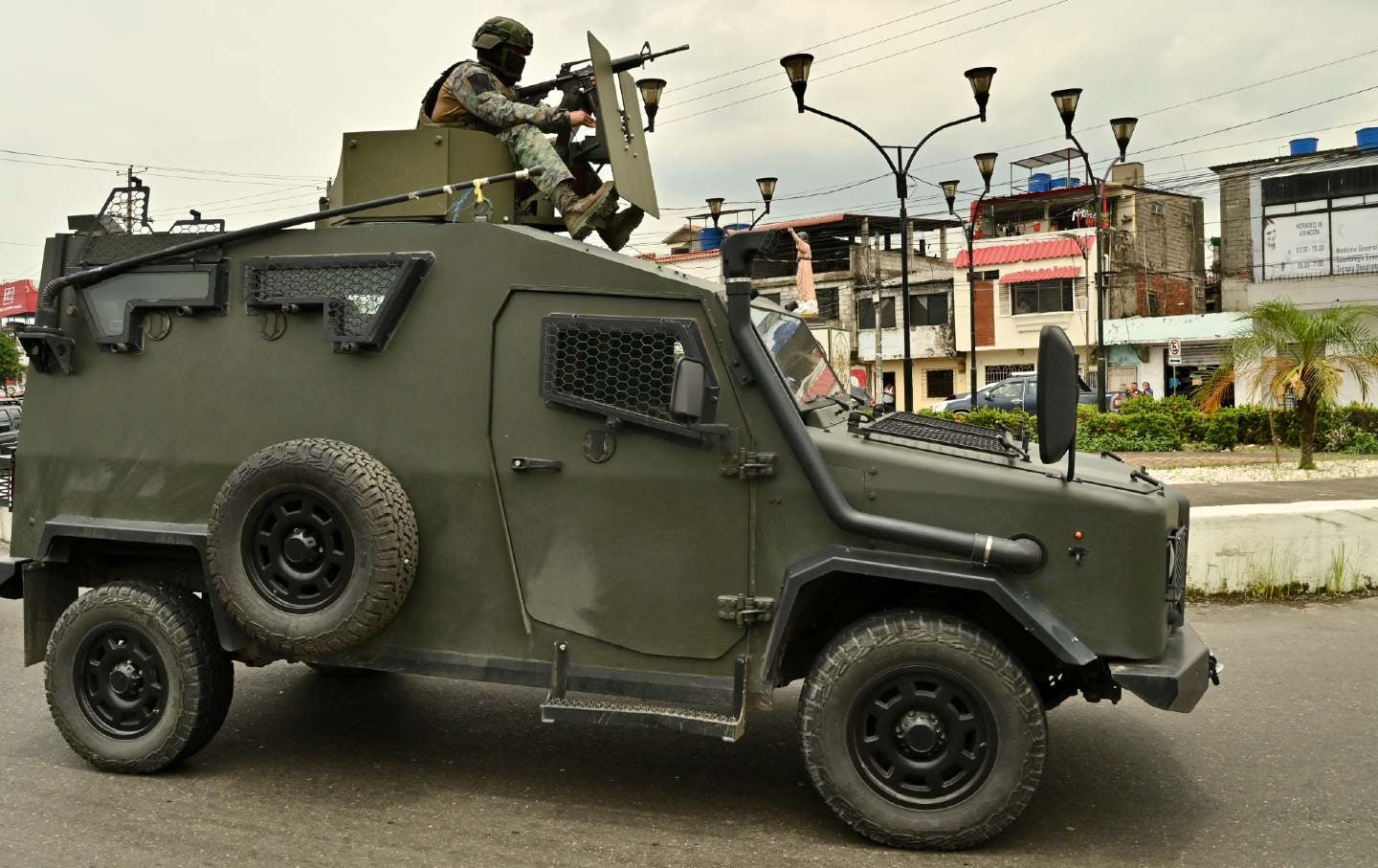 Ecuadoran armed forces patrol the streets in Duran, Guayas province, Ecuador, on March 15, 2026, during preparations for a US-supported military operation.